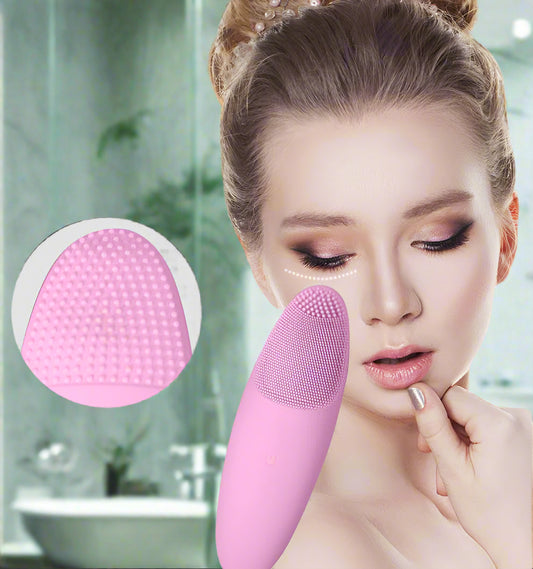Woman using a pink facial cleansing brush with close-up of brush head on a white background