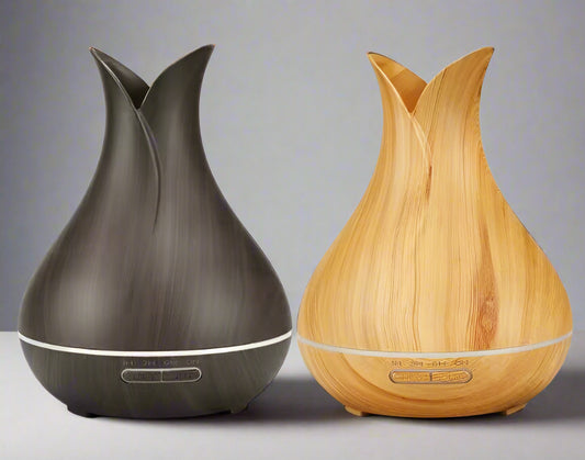 Two diffusers, one black and one wooden, on a white background