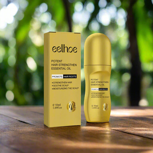 Gold bottle and box of eelhoe potent hair strengthen essential oil on a white background